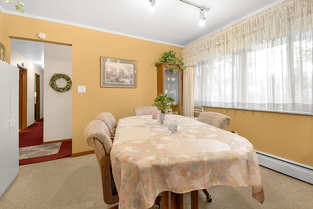 2116 Dunzweiler Dr, Zanesville, OH 43701 - carpeted dining area with baseboard heating, track lighting, baseboards, and ornamental molding