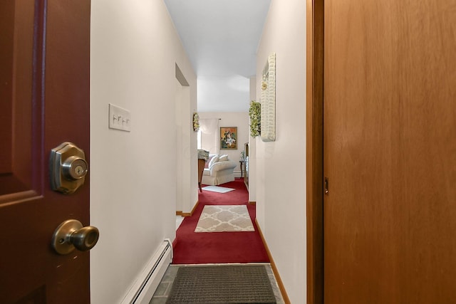 2116 Dunzweiler Dr, Zanesville, OH 43701 - corridor featuring a baseboard heating unit, carpet, and baseboards