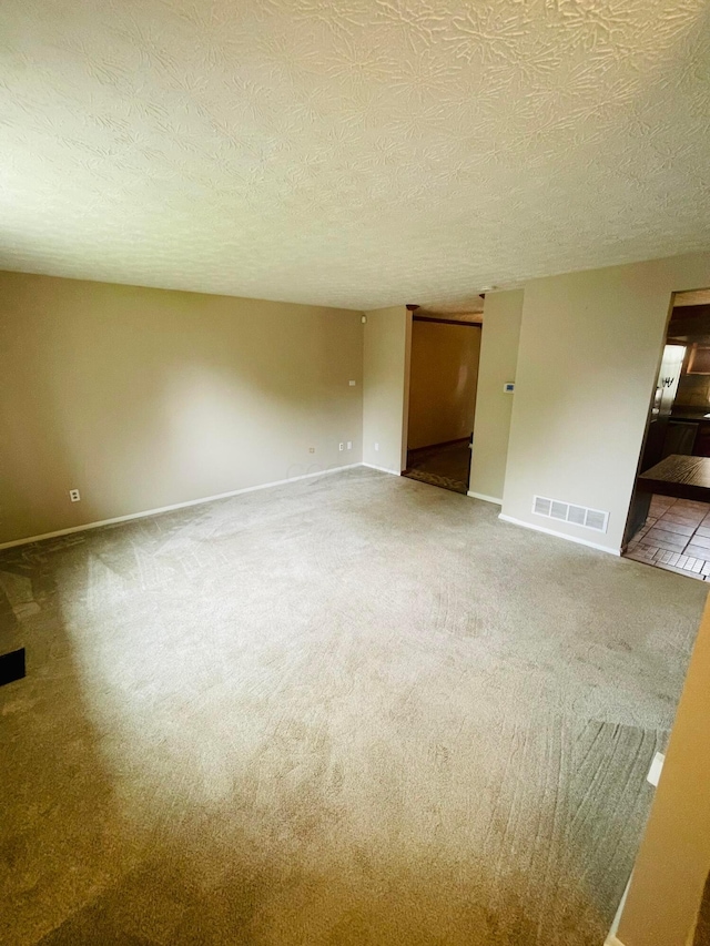 1275 Hathersage Pl, Galloway, OH 43119 - unfurnished room with carpet floors, a textured ceiling, and baseboards