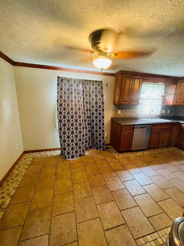 1275 Hathersage Pl, Galloway, OH 43119 - kitchen featuring stainless steel dishwasher, backsplash, baseboards, dark countertops, and crown molding