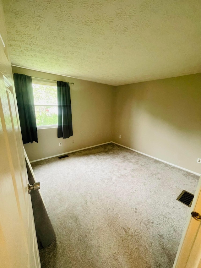 1275 Hathersage Pl, Galloway, OH 43119 - unfurnished room featuring carpet flooring, baseboards, and a textured ceiling