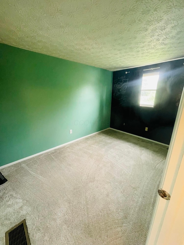 1275 Hathersage Pl, Galloway, OH 43119 - carpeted spare room featuring a textured ceiling and baseboards