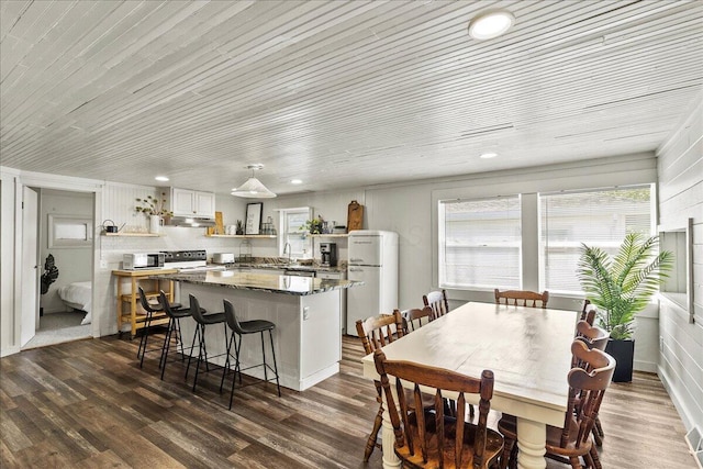 11526 Horseshoe Channel Dr, Lakeview, OH 43331 - dining space with dark wood finished floors, wooden ceiling, and recessed lighting