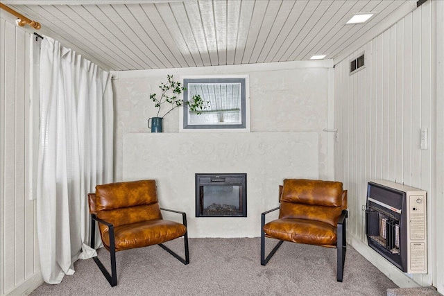 11526 Horseshoe Channel Dr, Lakeview, OH 43331 - living area with carpet floors, a glass covered fireplace, and wooden ceiling