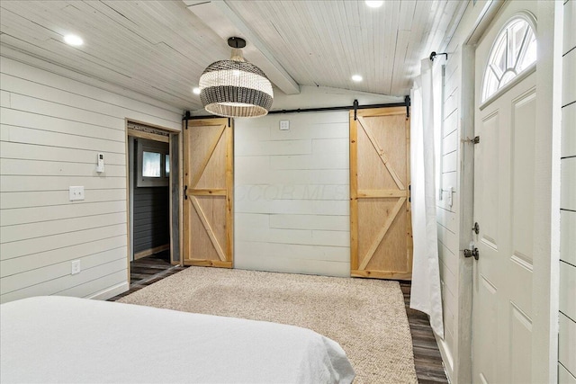 11526 Horseshoe Channel Dr, Lakeview, OH 43331 - bedroom with a barn door, recessed lighting, wood walls, wood ceiling, and multiple windows