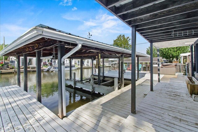 11526 Horseshoe Channel Dr, Lakeview, OH 43331 - dock with boat lift and a water view