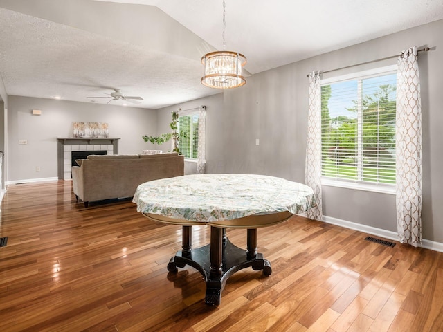 7020 Avery Rd, Dublin, OH 43017 - dining space featuring a ceiling fan, light wood finished floors, baseboards, and a textured ceiling