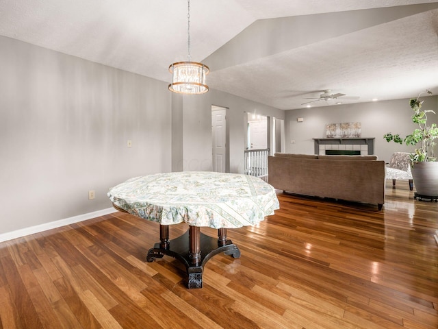7020 Avery Rd, Dublin, OH 43017 - dining area featuring lofted ceiling, wood finished floors, ceiling fan, a chandelier, and baseboards