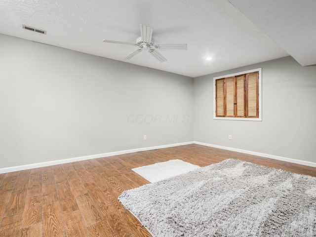 7020 Avery Rd, Dublin, OH 43017 - unfurnished room with baseboards, ceiling fan, wood finished floors, recessed lighting, and a textured ceiling