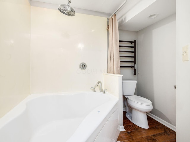 7020 Avery Rd, Dublin, OH 43017 - bathroom with toilet, shower / tub combo, wood finished floors, and baseboards