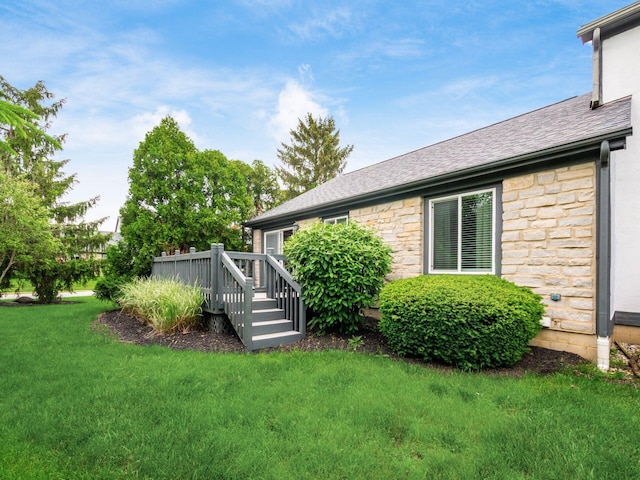 7020 Avery Rd, Dublin, OH 43017 - view of green lawn with a wooden deck