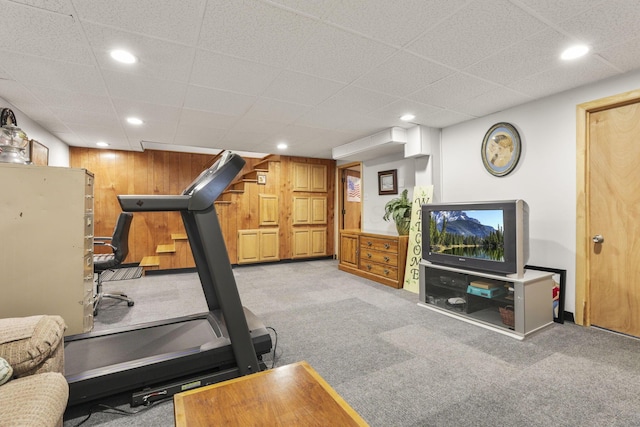 exercise room with light colored carpet, recessed lighting, and a drop ceiling