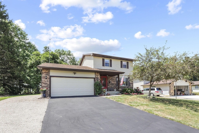 traditional home with a garage, asphalt driveway, a front yard, and stone siding