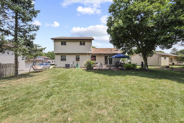 back of house featuring central air condition unit and a patio