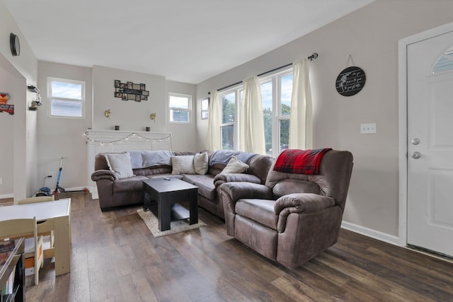 610 W Wheeling St, Lancaster, OH 43130 - living room featuring dark wood-style flooring and baseboards