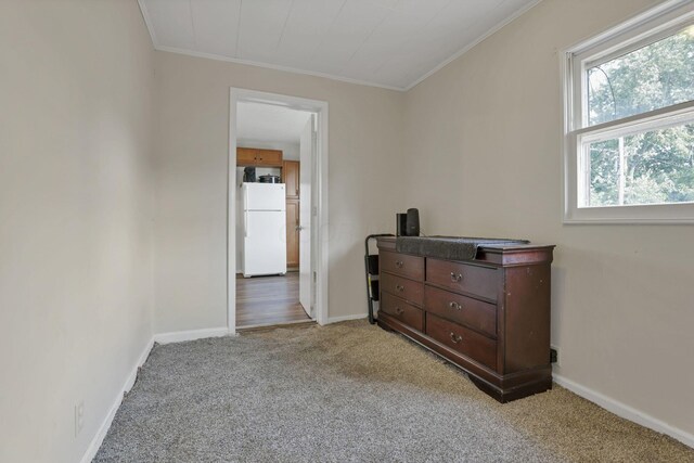 610 W Wheeling St, Lancaster, OH 43130 - bedroom featuring freestanding refrigerator, light colored carpet, ornamental molding, and baseboards