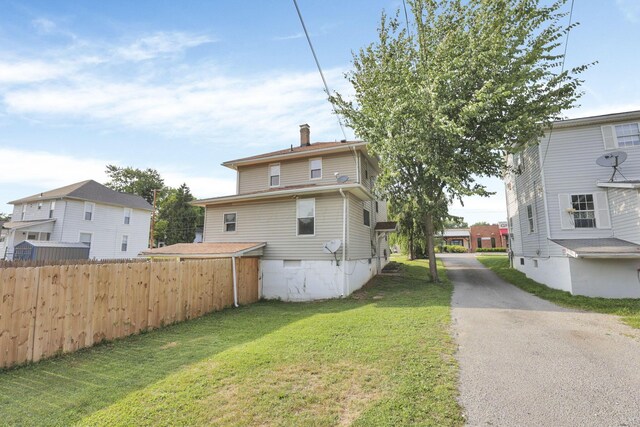 610 W Wheeling St, Lancaster, OH 43130 - rear view of house featuring a chimney and crawl space