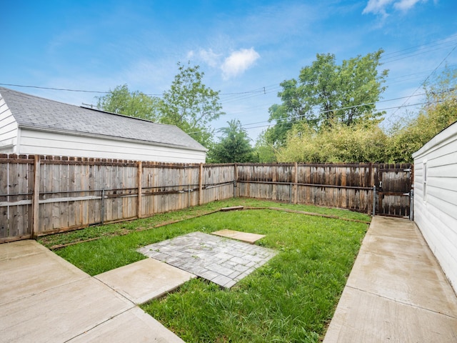 view of yard with a patio and a gate