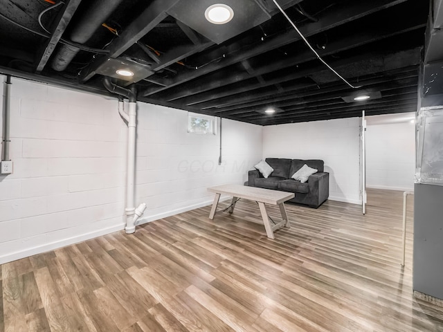 below grade area featuring wood finished floors