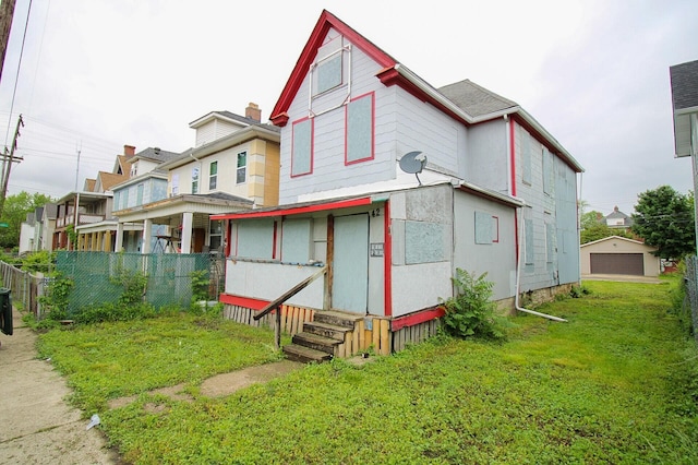 42 Rodgers Ave, Columbus, OH 43222 - back of house with entry steps and a detached garage