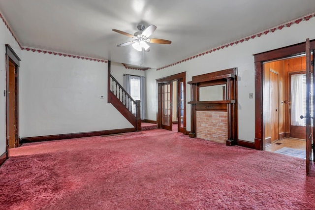 222 Union St, Lancaster, OH 43130 - carpeted empty room with baseboards, ceiling fan, and stairs