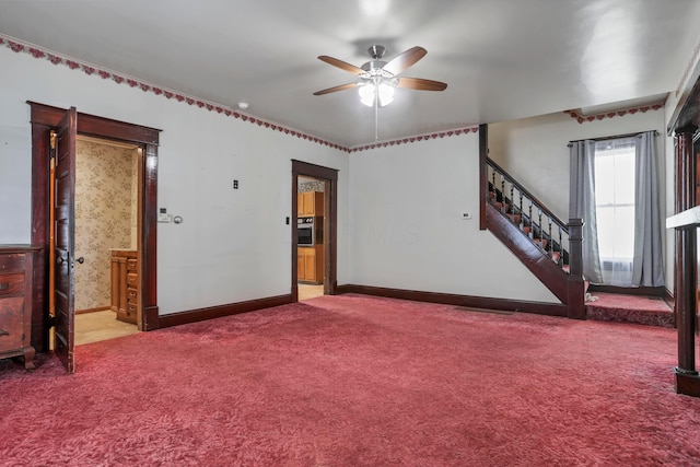 222 Union St, Lancaster, OH 43130 - carpeted empty room with ceiling fan, stairway, and baseboards