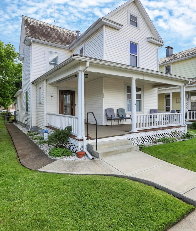 222 Union St, Lancaster, OH 43130 - view of front of house featuring a porch and a front yard