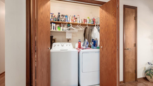 3890 Township Road 70 NW, Somerset, OH 43783 - laundry room featuring washer and dryer, wood finished floors, and baseboards