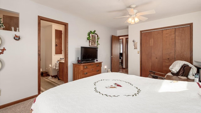 3890 Township Road 70 NW, Somerset, OH 43783 - bedroom featuring a closet, baseboards, carpet floors, connected bathroom, and ceiling fan