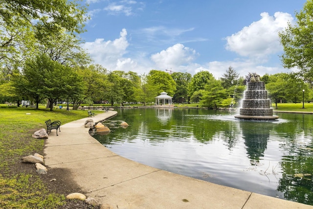 view of home's community featuring a water view and view of wooded area
