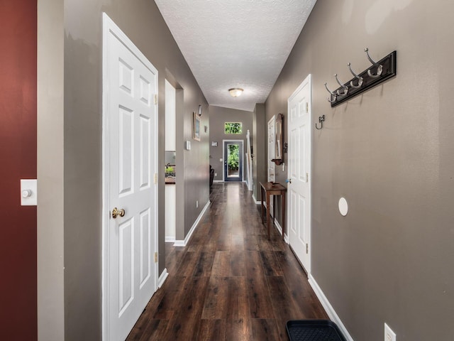 299 Stonhope Dr, Delaware, OH 43015 - hallway featuring a textured ceiling and dark wood-type flooring