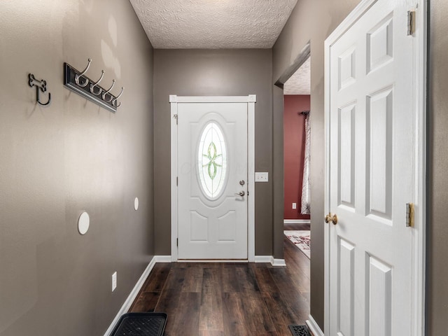 299 Stonhope Dr, Delaware, OH 43015 - foyer featuring dark wood-type flooring and a textured ceiling