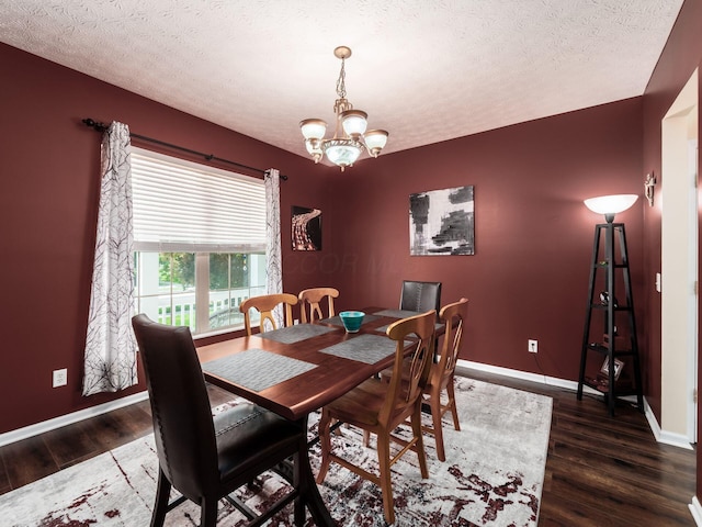 299 Stonhope Dr, Delaware, OH 43015 - dining room with wood finished floors, a chandelier, and a textured ceiling