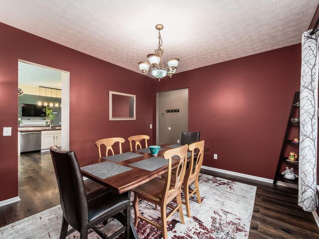 299 Stonhope Dr, Delaware, OH 43015 - dining room with wood finished floors, a textured ceiling, and a chandelier