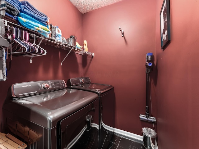 299 Stonhope Dr, Delaware, OH 43015 - laundry room with washer and clothes dryer and baseboards