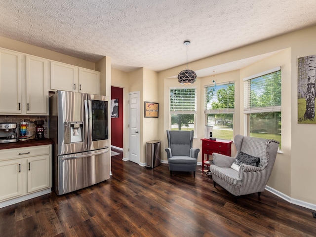 299 Stonhope Dr, Delaware, OH 43015 - kitchen featuring stainless steel fridge, dark wood finished floors, healthy amount of natural light, tasteful backsplash, and a textured ceiling