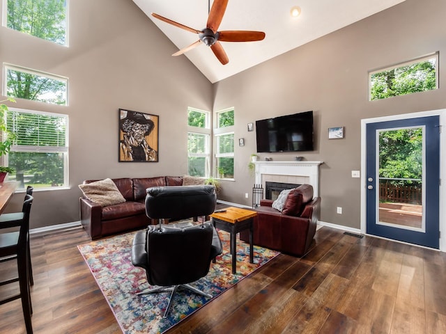 299 Stonhope Dr, Delaware, OH 43015 - living area with high vaulted ceiling, a tile fireplace, dark wood-style flooring, and ceiling fan