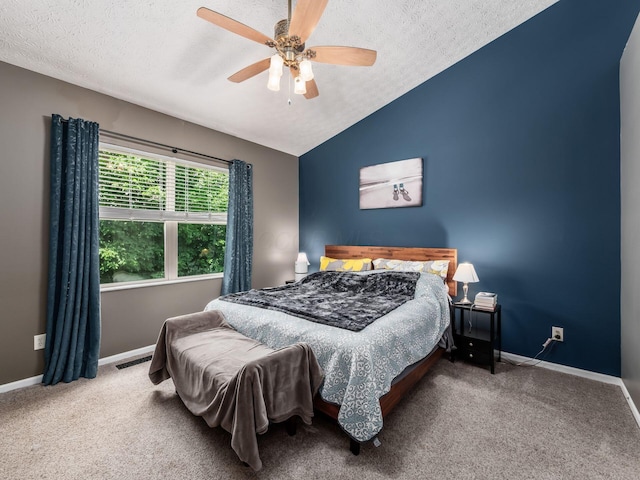 299 Stonhope Dr, Delaware, OH 43015 - bedroom featuring a textured ceiling, vaulted ceiling, carpet, and ceiling fan