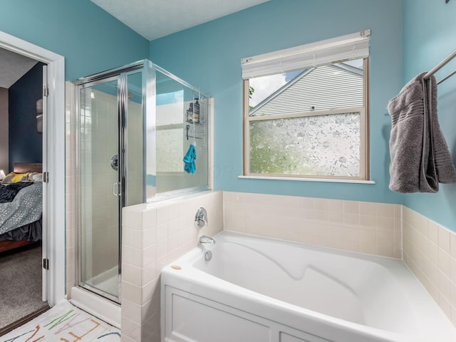 299 Stonhope Dr, Delaware, OH 43015 - bathroom featuring ensuite bathroom, a bath, and a shower stall