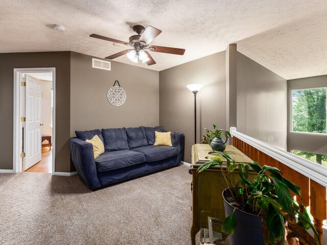 299 Stonhope Dr, Delaware, OH 43015 - living room with ceiling fan, a textured ceiling, and carpet