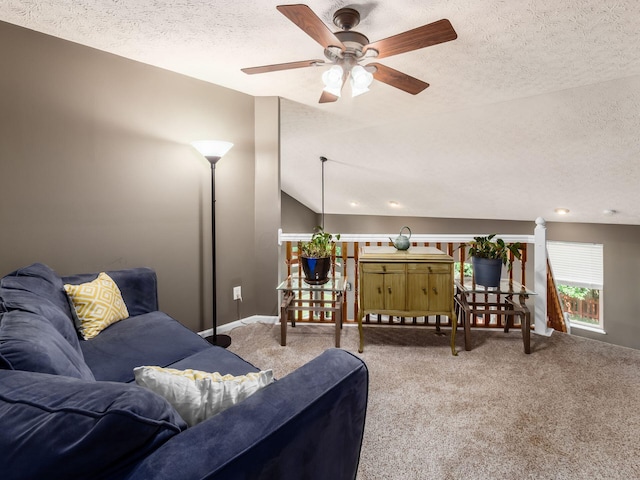 299 Stonhope Dr, Delaware, OH 43015 - carpeted living room featuring a textured ceiling, a ceiling fan, and lofted ceiling