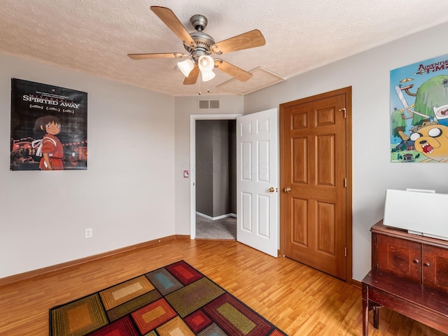 299 Stonhope Dr, Delaware, OH 43015 - bedroom featuring wood finished floors, a textured ceiling, and a ceiling fan