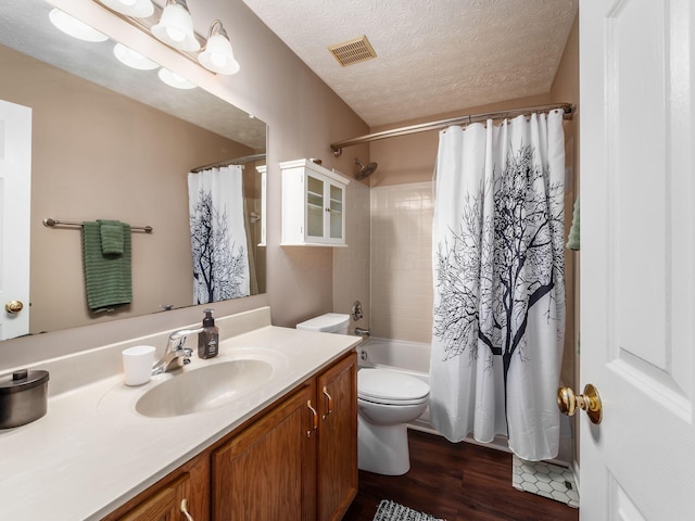 299 Stonhope Dr, Delaware, OH 43015 - full bathroom with vanity, wood finished floors, a textured ceiling, and shower / tub combo with curtain