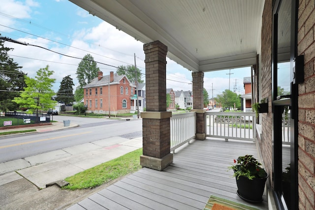 459 E Whittier St, Columbus, OH 43206 - wooden deck featuring covered porch and a residential view