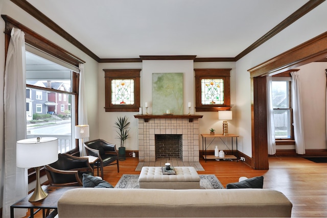 459 E Whittier St, Columbus, OH 43206 - living room with wood finished floors, baseboards, ornamental molding, and a fireplace