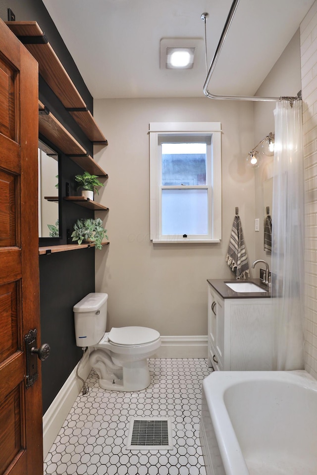459 E Whittier St, Columbus, OH 43206 - bathroom with toilet, baseboards, tile patterned flooring, and curtained shower