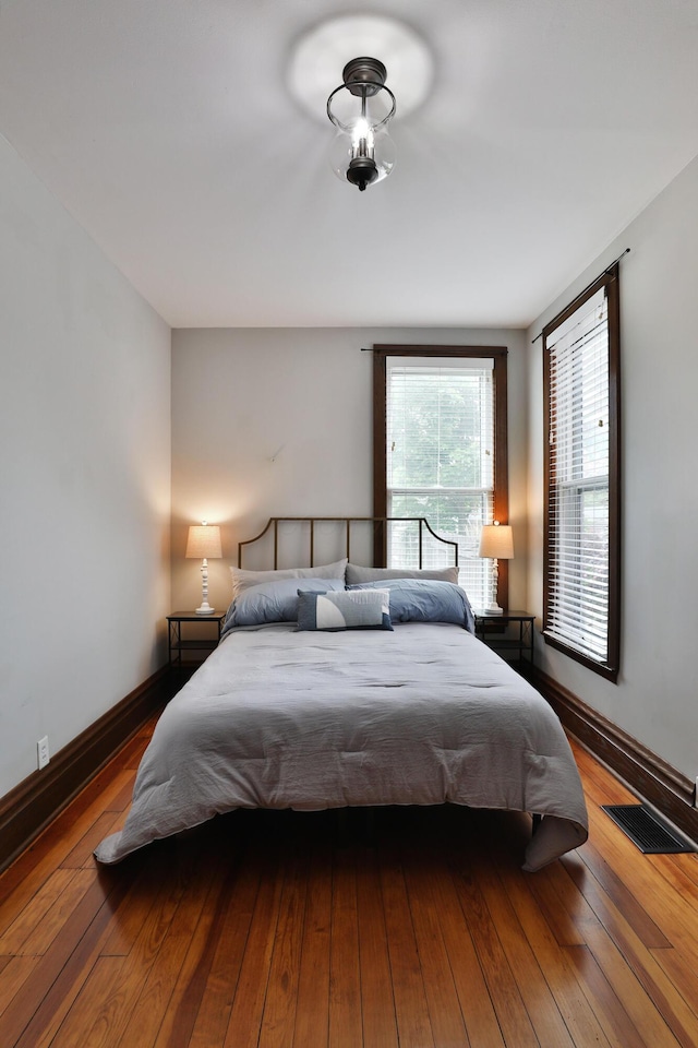 459 E Whittier St, Columbus, OH 43206 - bedroom with wood-type flooring and baseboards