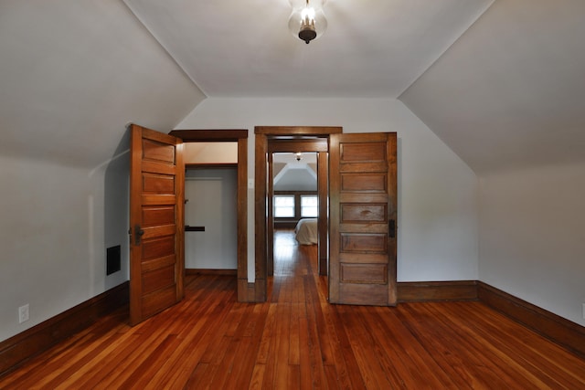459 E Whittier St, Columbus, OH 43206 - additional living space with vaulted ceiling, dark wood-type flooring, and baseboards