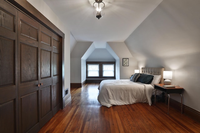 459 E Whittier St, Columbus, OH 43206 - bedroom with dark wood-style flooring, baseboards, and lofted ceiling