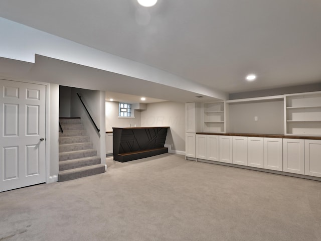 459 E Whittier St, Columbus, OH 43206 - basement with light carpet, bar area, baseboards, stairs, and recessed lighting